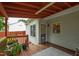 Cozy covered deck perfect for outdoor seating and relaxation overlooking backyard at 102 W Hill Dr, Cary, NC 27519