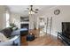 Inviting living room featuring a fireplace, hardwood floors, and an abundance of natural light at 102 W Hill Dr, Cary, NC 27519