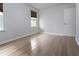Bedroom with wood-look flooring and two windows at 1021 Benay Rd, Morrisville, NC 27560