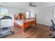 Bright bedroom features wood floors and a ceiling fan at 1021 Benay Rd, Morrisville, NC 27560
