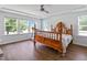 Bright bedroom with three windows and wood floors at 1021 Benay Rd, Morrisville, NC 27560
