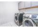 Well-equipped laundry room with modern appliances and storage cabinets, perfect for convenient laundry care at 1021 Benay Rd, Morrisville, NC 27560