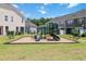 Community playground featuring slides, climbing structures, and benches, perfect for Gathering fun and recreation at 1021 Benay Rd, Morrisville, NC 27560