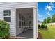 Inviting screened porch with comfortable seating, perfect for relaxing and enjoying the outdoors at 1021 Benay Rd, Morrisville, NC 27560
