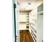 Spacious walk-in closet with wood flooring and shelving units at 1021 Benay Rd, Morrisville, NC 27560