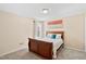 This bedroom offers a comfortable space with carpeted floors and a window for natural light at 105 Putters Ct, Durham, NC 27703