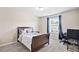Bedroom with window, curtains, and desk at 105 Putters Ct, Durham, NC 27703