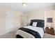 This bedroom features a comfortable bed with a padded headboard and access to a walk-in closet at 105 Putters Ct, Durham, NC 27703