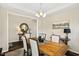 Dining area featuring a wooden table, chandelier, and stylish decor; a mirror is visible in the background at 105 Putters Ct, Durham, NC 27703