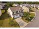 Aerial view of a charming two-story home with a two car garage and a well-maintained front lawn at 105 Putters Ct, Durham, NC 27703