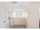 Carpeted upstairs hallway with natural light streaming through the windows and doors at 105 Putters Ct, Durham, NC 27703