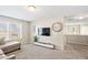 Upstairs living room with a media console and view of the outdoors through a window at 105 Putters Ct, Durham, NC 27703