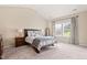 Cozy main bedroom with vaulted ceiling, carpet flooring, and a window with natural light at 105 Putters Ct, Durham, NC 27703