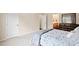 Bedroom featuring neutral tones, and carpet flooring; an ensuite bath is visible through the doorway at 105 Putters Ct, Durham, NC 27703