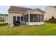 Patio features an outdoor grill and a screened-in porch ideal for relaxing and entertaining guests at 105 Putters Ct, Durham, NC 27703