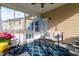 Screened porch with outdoor seating, ceiling fan, and views of backyard at 105 Putters Ct, Durham, NC 27703