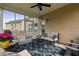 Bright sunroom showcasing comfortable seating, a decorative rug, and a view of the backyard at 105 Putters Ct, Durham, NC 27703
