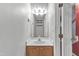 Bathroom featuring a single sink vanity, a large mirror, and neutral decor at 105 Trailwood Ct, Chapel Hill, NC 27516