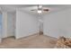 This bedroom features white walls, a ceiling fan, and a tan carpet at 105 Trailwood Ct, Chapel Hill, NC 27516