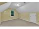 Attic bedroom with carpet floors, a window, sloped ceilings, and ample natural light at 105 Trailwood Ct, Chapel Hill, NC 27516