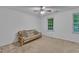 A cozy bedroom featuring a daybed, ceiling fan, and a window with blinds at 105 Trailwood Ct, Chapel Hill, NC 27516