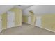 Upstairs bedroom with carpet and a window, featuring multiple closet spaces at 105 Trailwood Ct, Chapel Hill, NC 27516