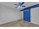 The bedroom offers bright white walls, a ceiling fan, and access to the bathroom at 105 Trailwood Ct, Chapel Hill, NC 27516