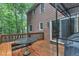 Deck area features a table, a grill, and sliding doors leading into the house at 105 Trailwood Ct, Chapel Hill, NC 27516