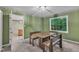 Dining room with wooden table and chairs, large window, and neutral walls and carpeting at 105 Trailwood Ct, Chapel Hill, NC 27516