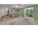 Spacious living room with fireplace, neutral carpet, ceiling fan and access to dining room at 105 Trailwood Ct, Chapel Hill, NC 27516