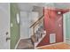 Carpeted staircase with wood railing and spindles leading to the upper level of the home at 105 Trailwood Ct, Chapel Hill, NC 27516