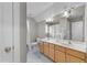 Neutral toned bathroom with double vanity and tile flooring at 10579 Evergreen Spring Pl, Raleigh, NC 27614