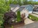 Exterior view of well-maintained home with lush landscaping and a private driveway at 10579 Evergreen Spring Pl, Raleigh, NC 27614