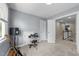 Versatile room featuring neutral carpeting and a view of the landing at 10579 Evergreen Spring Pl, Raleigh, NC 27614