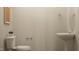 Simple half bathroom with modern fixtures, including a pedestal sink and a standard toilet at 108 Fishing Pier Way, Lillington, NC 27546