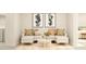 Comfortable living room featuring a modern sofa, decorative pillows, and stylish artwork at 108 Fishing Pier Way, Lillington, NC 27546