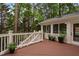 Exterior view of the back deck with stairs leading to the yard and a sunroom at 108 Vescova Ln, Morrisville, NC 27560
