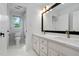 Bright bathroom with double vanity, marble countertops, and classic black framed mirror at 108 Vescova Ln, Morrisville, NC 27560