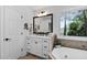 Bright bathroom featuring a vanity and a large window providing natural light at 108 Vescova Ln, Morrisville, NC 27560