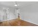 Bedroom featuring hardwood floors, ceiling fan and multiple doors at 108 Vescova Ln, Morrisville, NC 27560