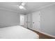 Bedroom with a ceiling fan and a door at 108 Vescova Ln, Morrisville, NC 27560