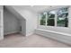 Bright bedroom featuring neutral carpet, a window seat with ample natural light and crown molding at 108 Vescova Ln, Morrisville, NC 27560