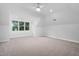 Bright bedroom featuring neutral carpet, a ceiling fan, and a window seat with ample natural light at 108 Vescova Ln, Morrisville, NC 27560