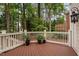 Spacious wooden deck with white railings overlooking a peaceful backyard at 108 Vescova Ln, Morrisville, NC 27560