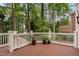 Large wooden deck with white railings overlooking mature trees at 108 Vescova Ln, Morrisville, NC 27560