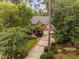 Beautiful brick home showcasing lush landscaping, a long driveway, and a traditional design at 108 Vescova Ln, Morrisville, NC 27560