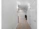 Hallway area featuring neutral carpet and sconce lighting at 108 Vescova Ln, Morrisville, NC 27560