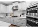 Close up shot of the modern kitchen with white cabinetry and marble countertops at 108 Vescova Ln, Morrisville, NC 27560