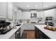Bright kitchen featuring stainless appliances, white cabinetry, and marble countertops at 108 Vescova Ln, Morrisville, NC 27560