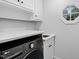Laundry room featuring patterned floors, machines, and small window at 108 Vescova Ln, Morrisville, NC 27560